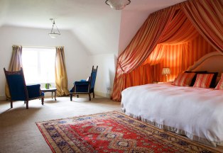 Princess Room - Orange and cream striped draped canopy Super king size bed En-suite with power shower Overlooking the fountain with stunning views Flat screen TV/DVD